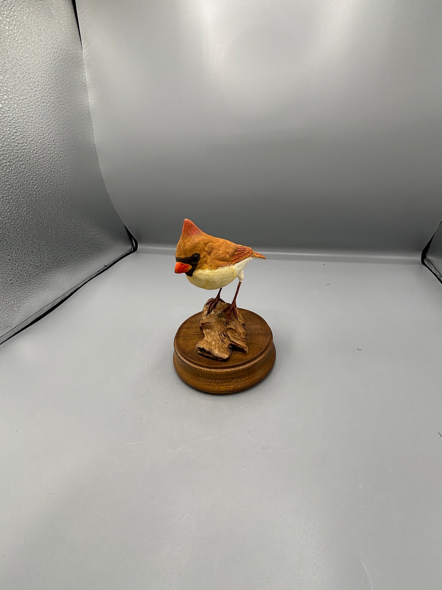 Female Cardinal bird on wood figure