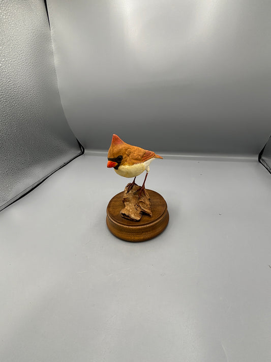 Female Cardinal bird on wood figure