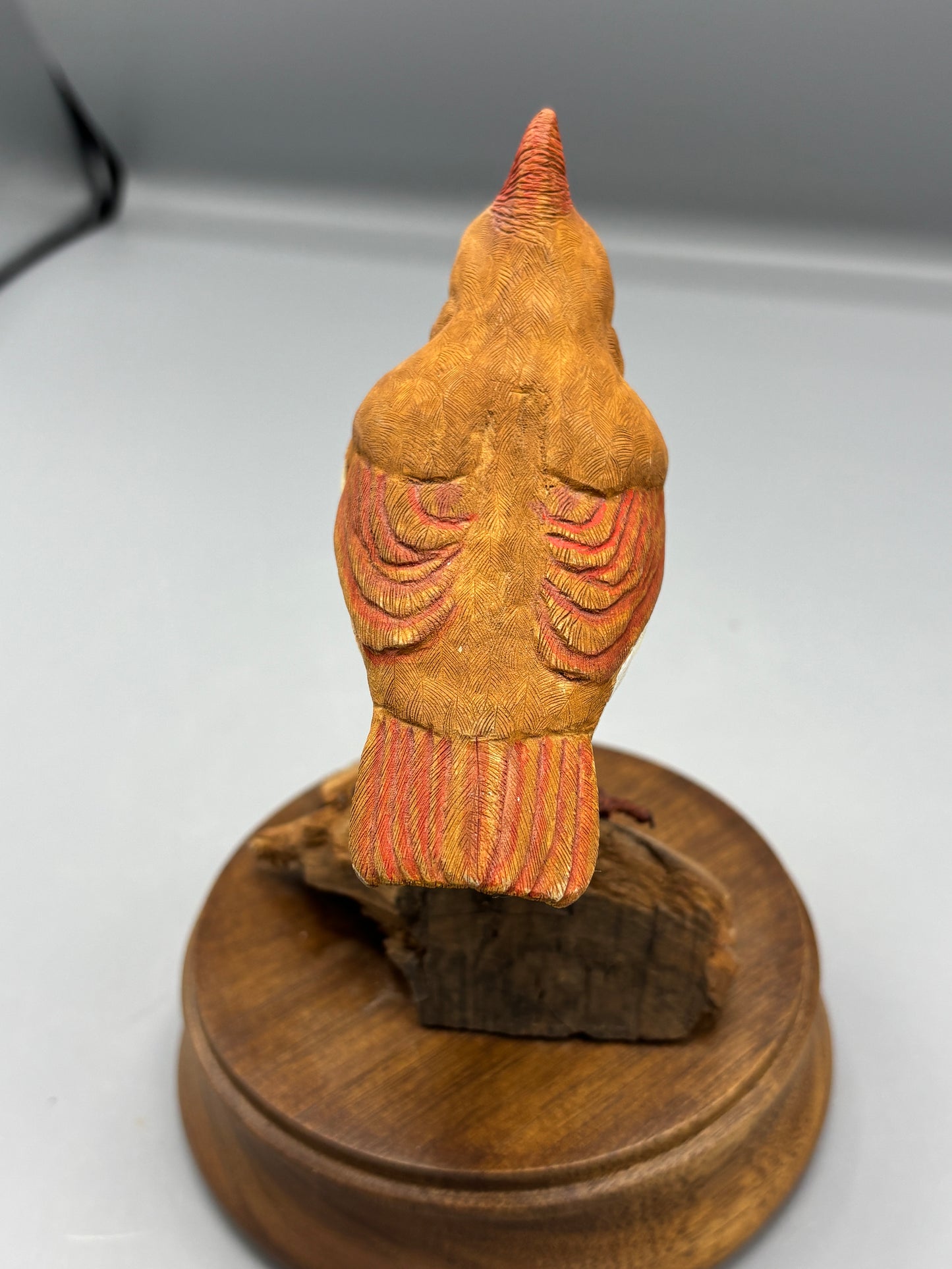 Female Cardinal bird on wood figure