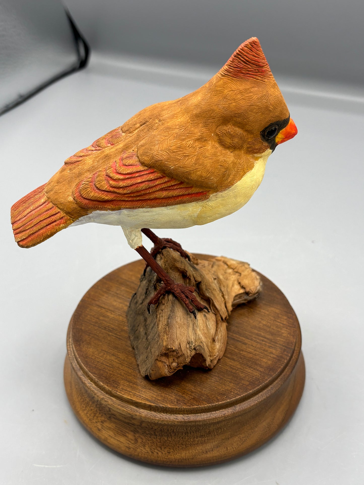 Female Cardinal bird on wood figure