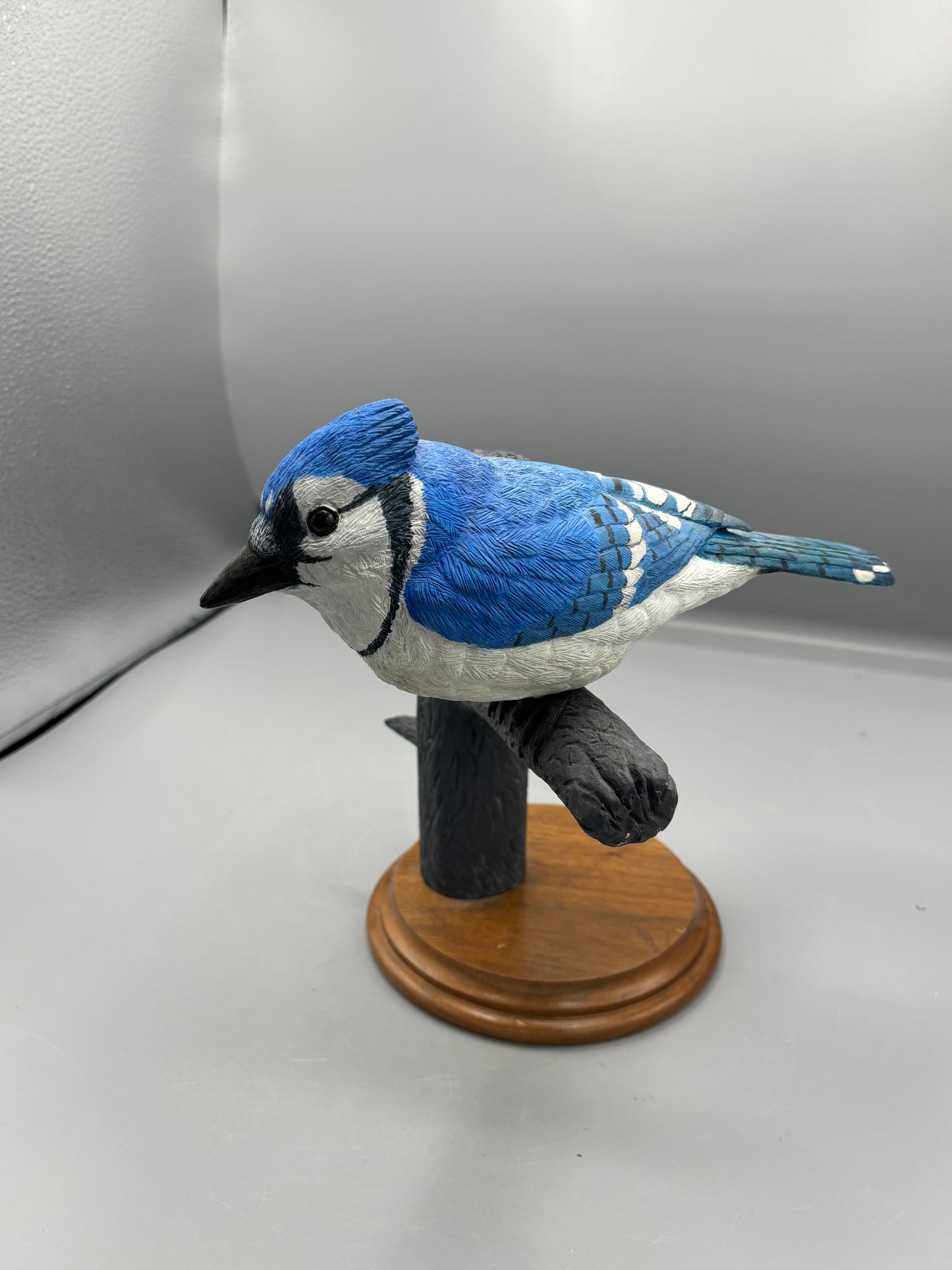 Wooden hand carved Blue Jay on branch
