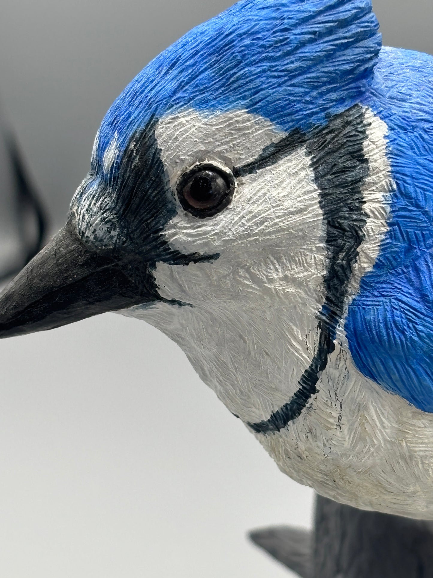 Wooden hand carved Blue Jay on branch