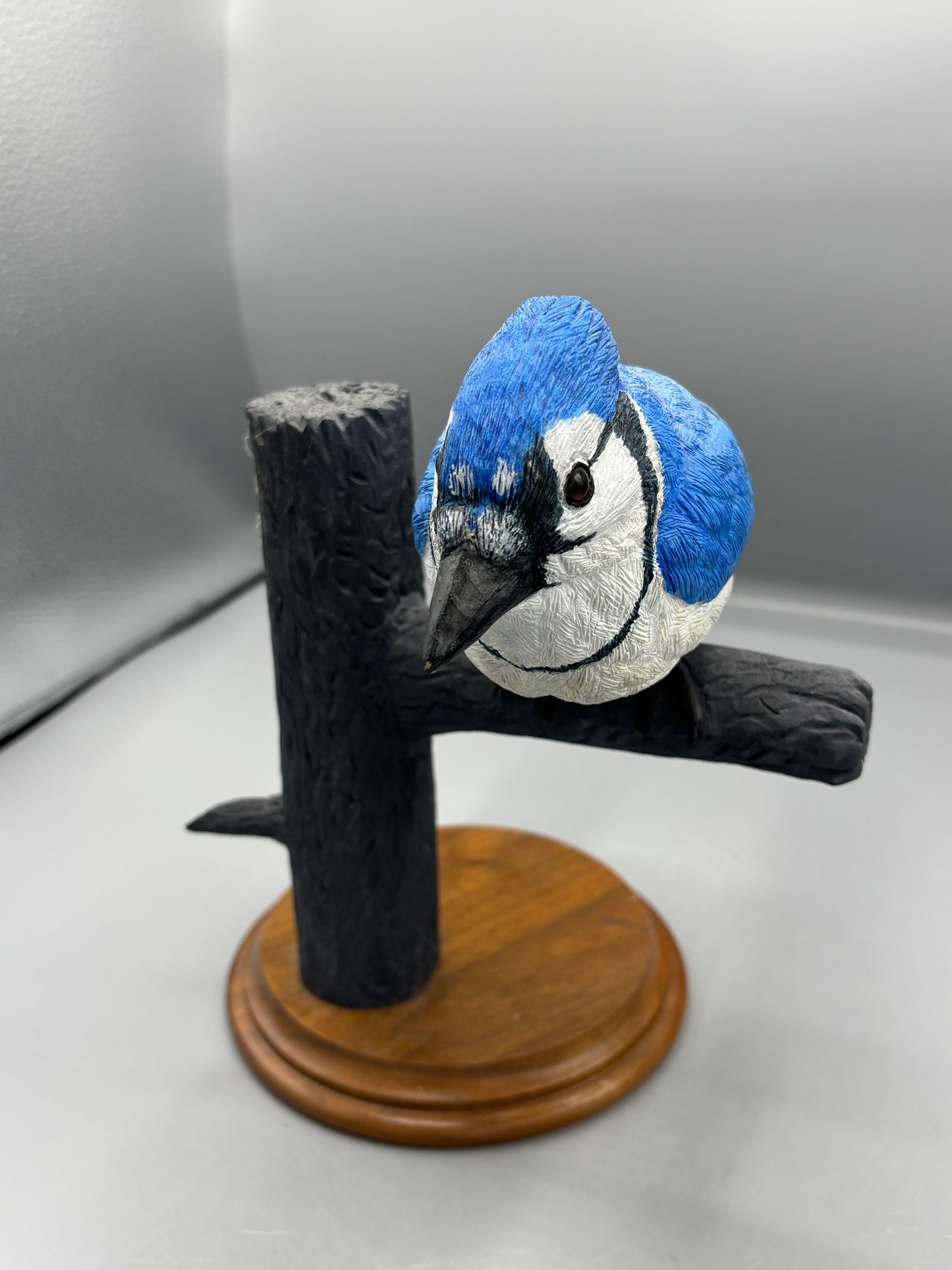 Wooden hand carved Blue Jay on branch