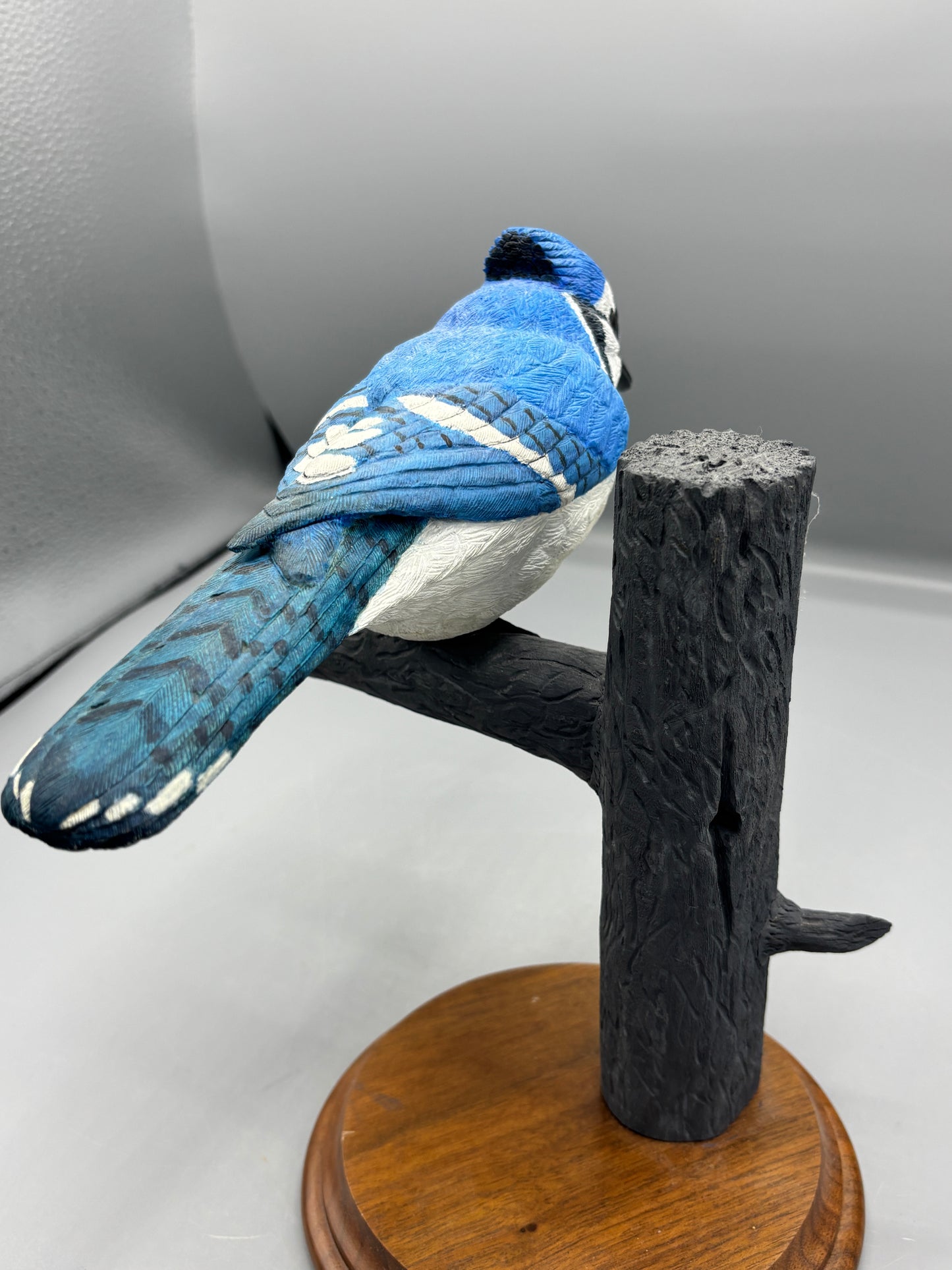 Wooden hand carved Blue Jay on branch