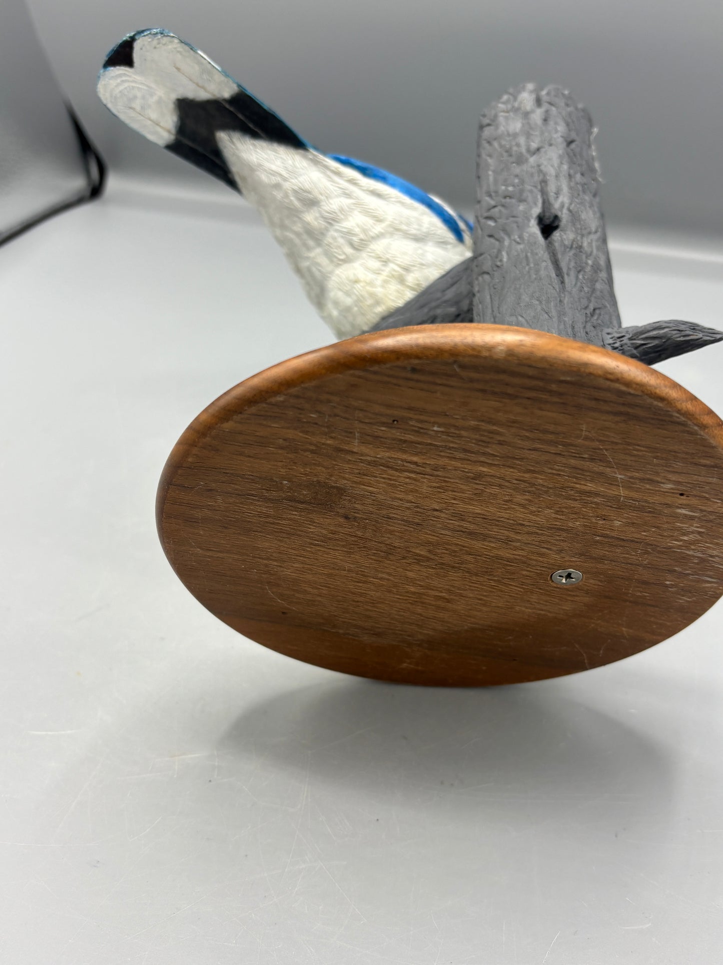 Wooden hand carved Blue Jay on branch