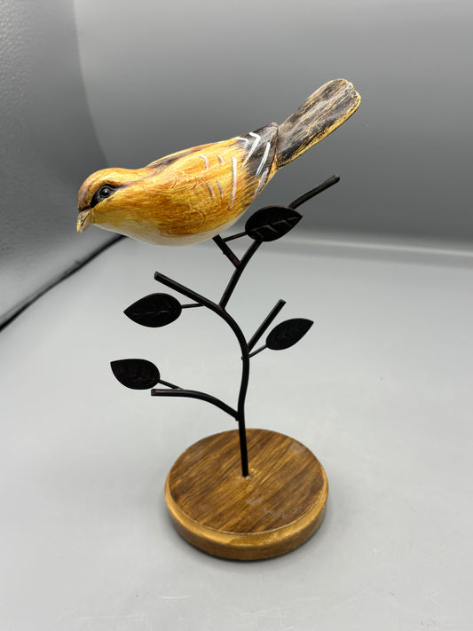 Carved Wren bird on metal branch
