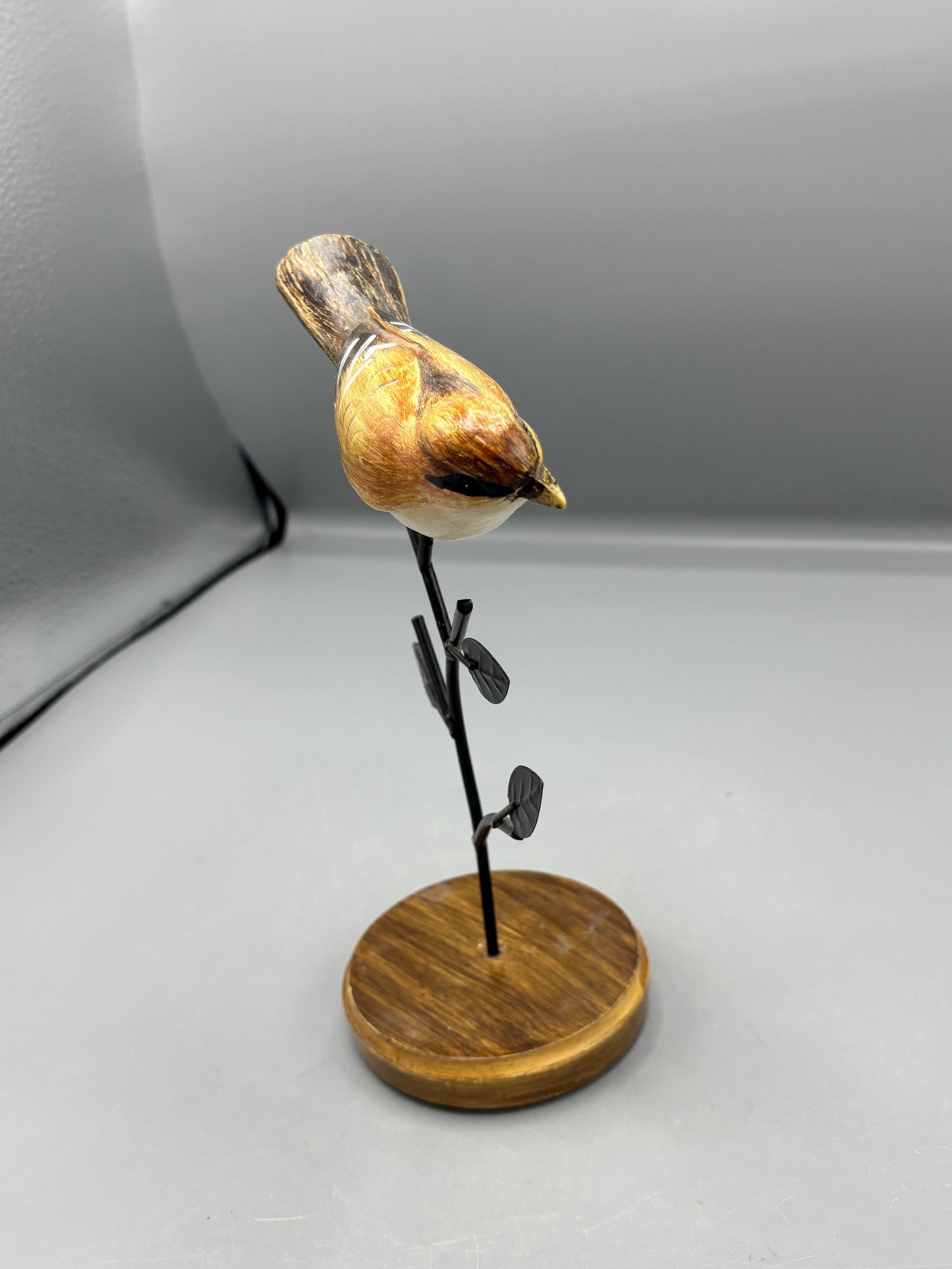Carved Wren bird on metal branch