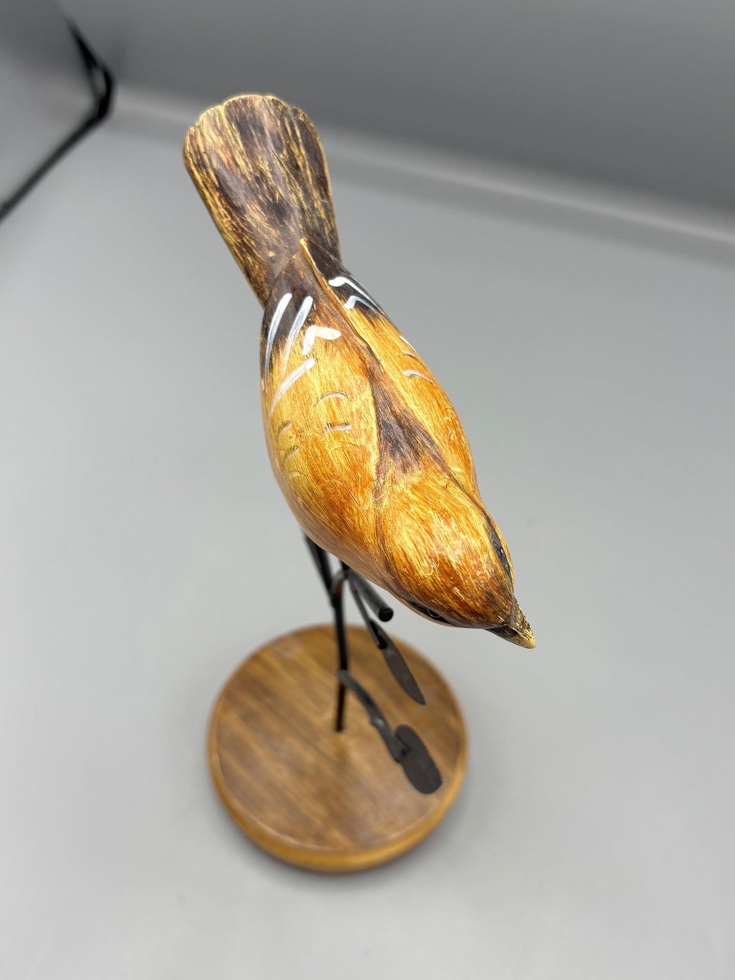 Carved Wren bird on metal branch