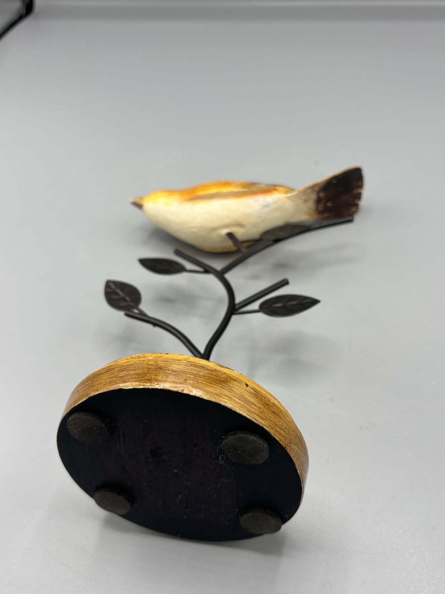 Carved Wren bird on metal branch
