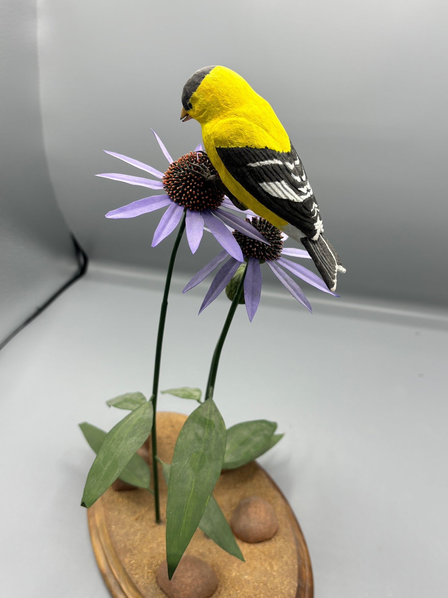 American gold Finch thistle sculpture on metal flowers