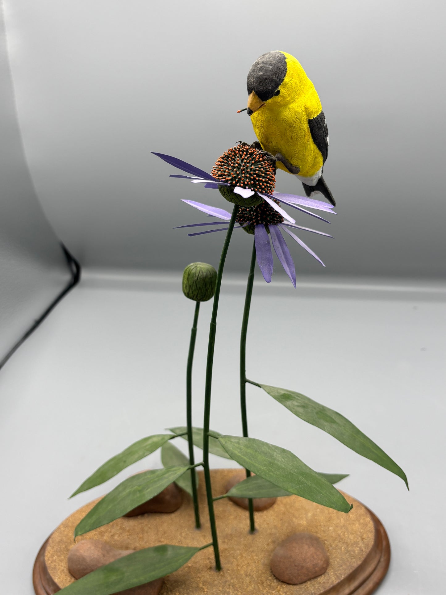 American gold Finch thistle sculpture on metal flowers