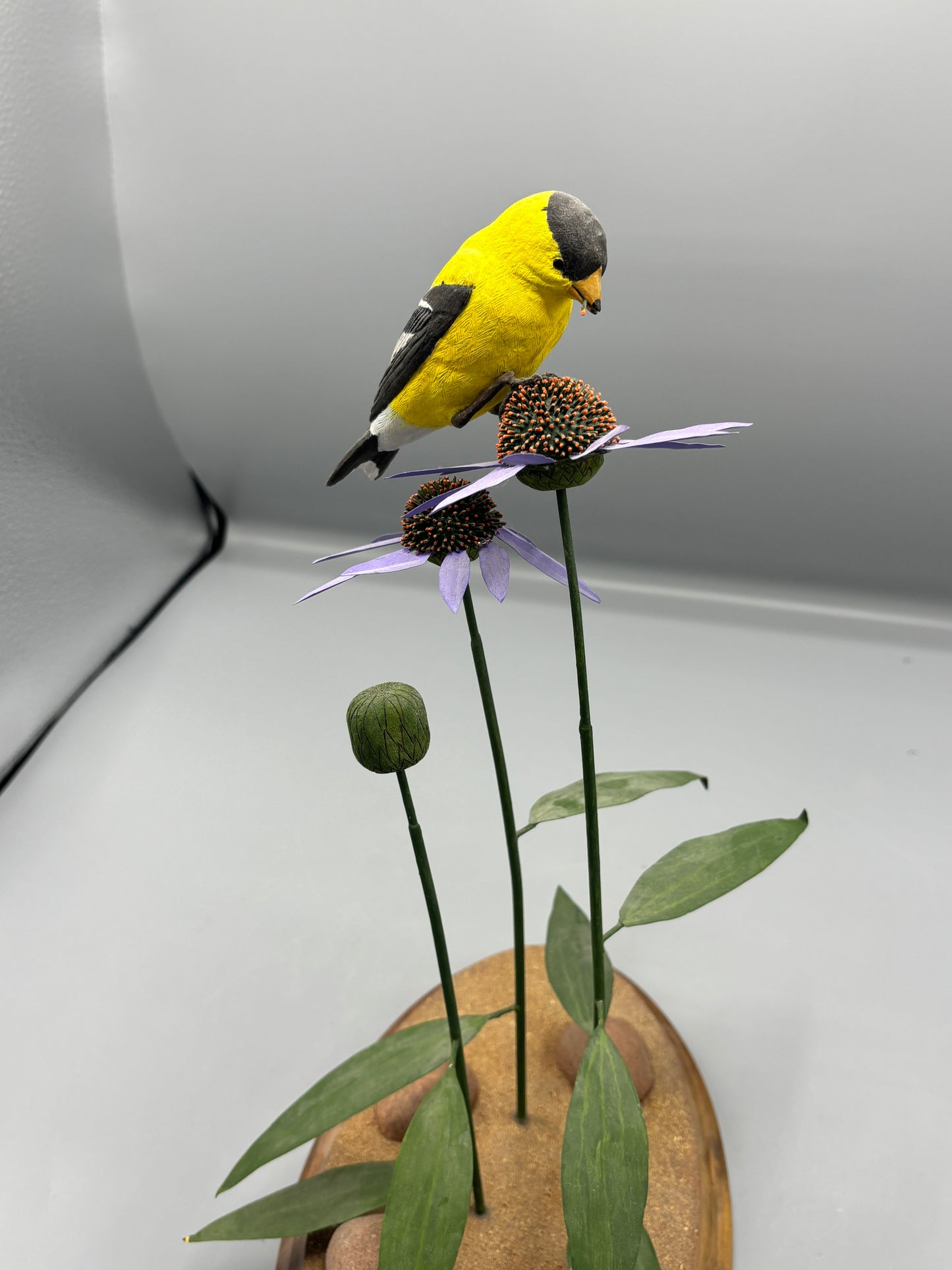 American gold Finch thistle sculpture on metal flowers