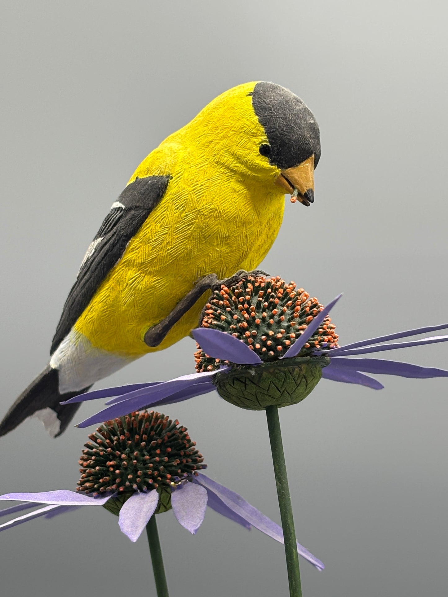 American gold Finch thistle sculpture on metal flowers