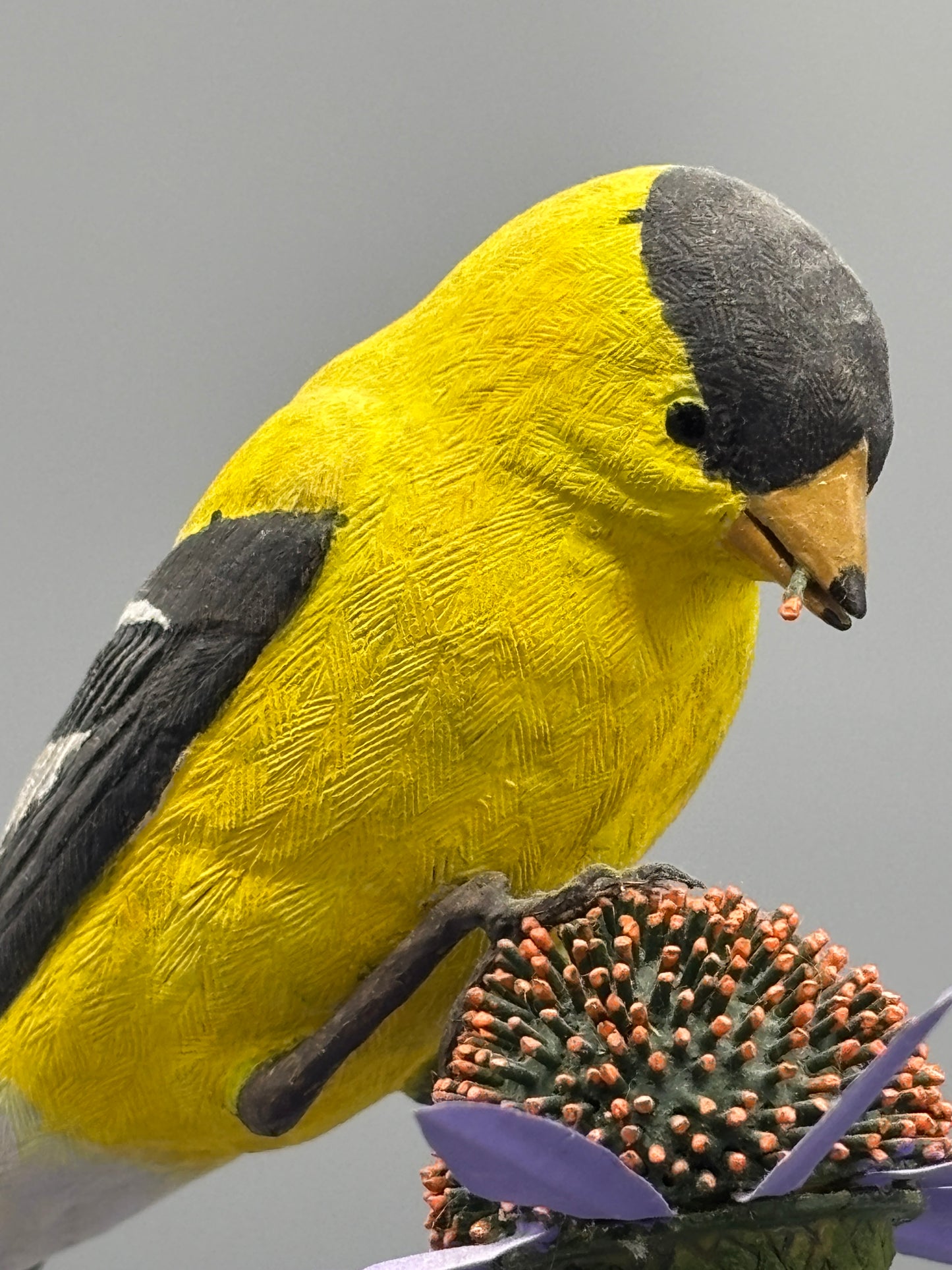American gold Finch thistle sculpture on metal flowers