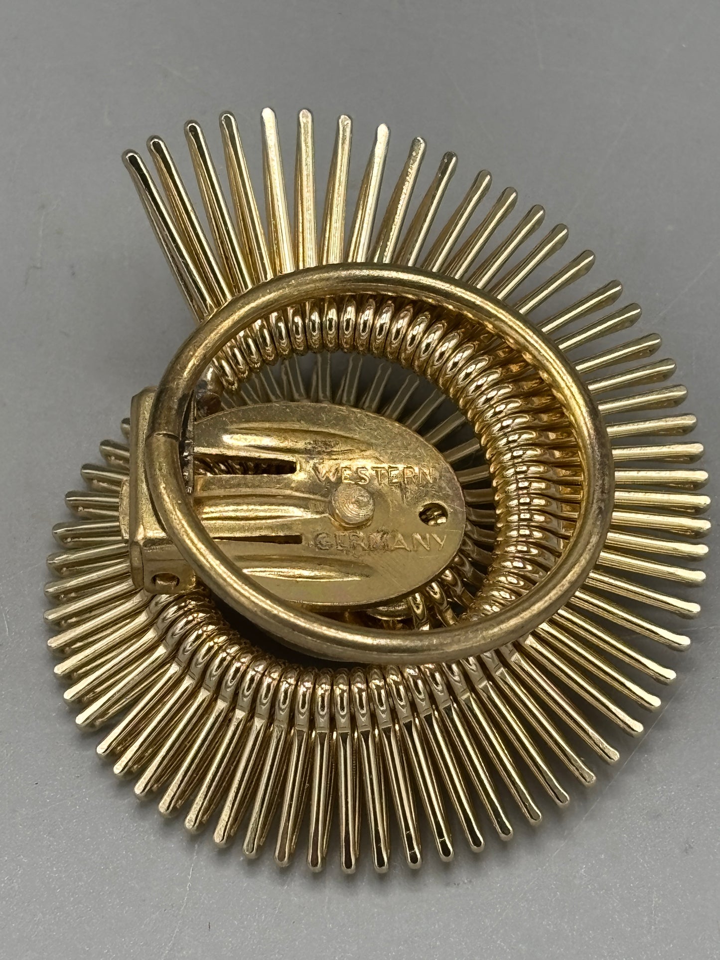 Vintage gold tone West Germany scarf clip spiral design
