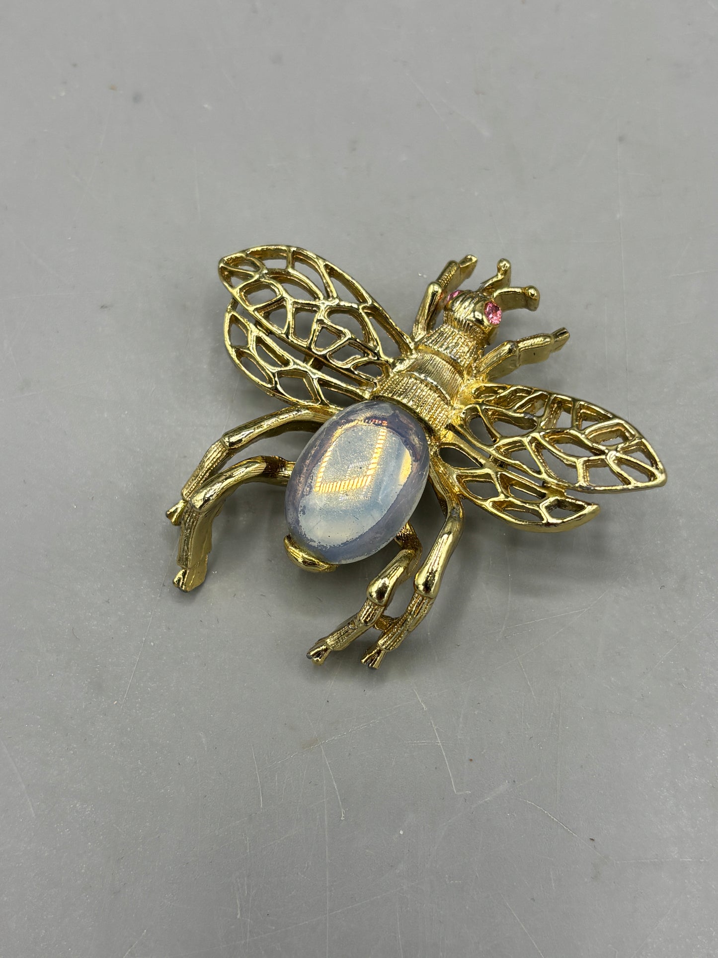 Vintage gold tone bee brooch with moonstone