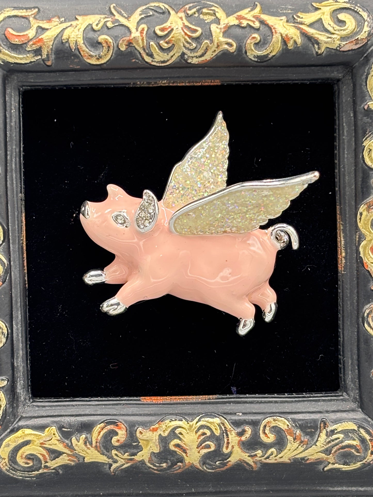 Black frame with pink flying pig