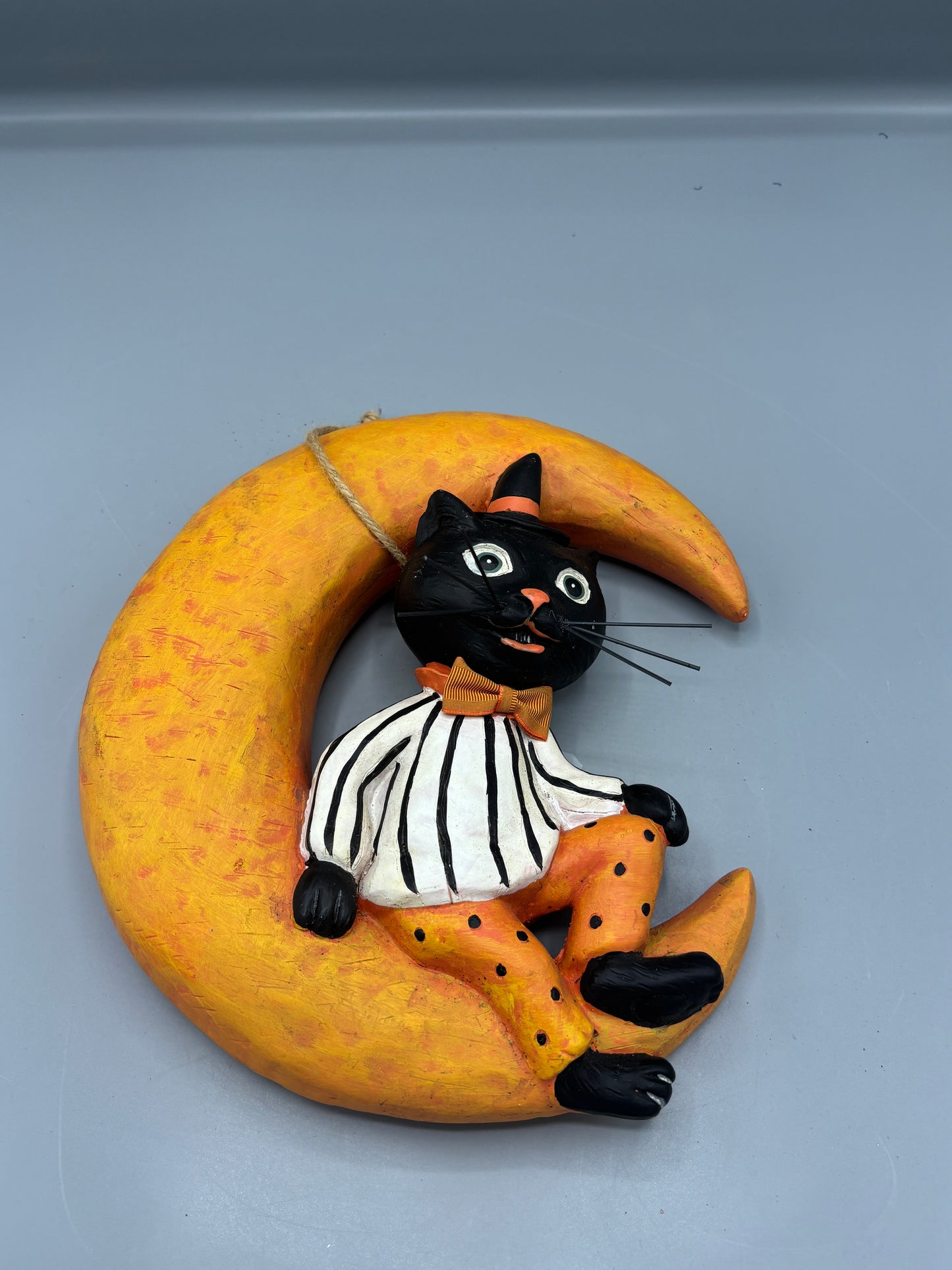 Vintage Black cat sitting on Moon wall