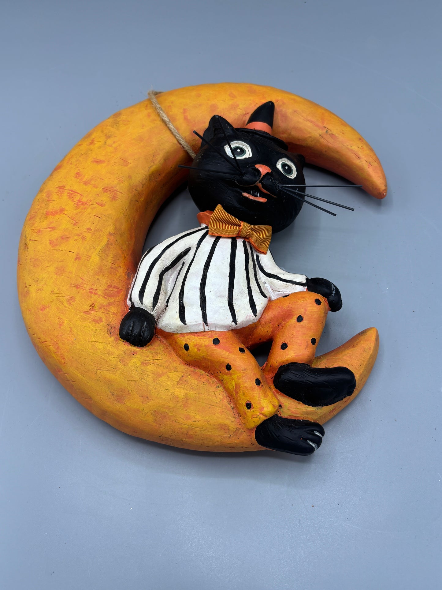 Vintage Black cat sitting on Moon wall