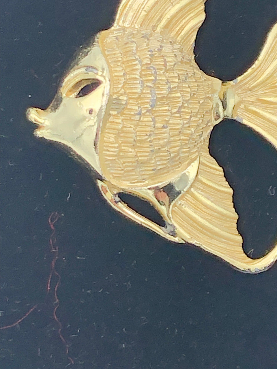 Gold tone fish pin