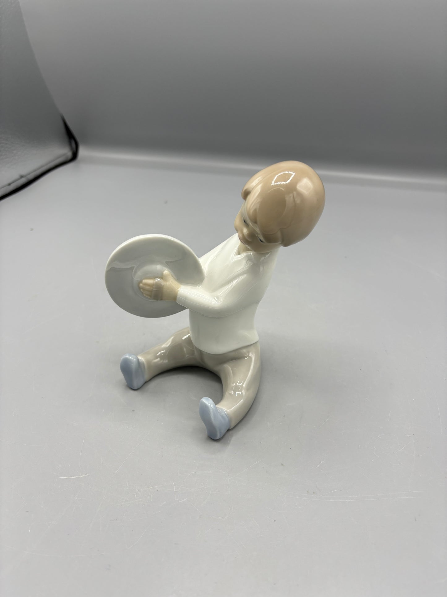 Lladro Boy playing Cymbals