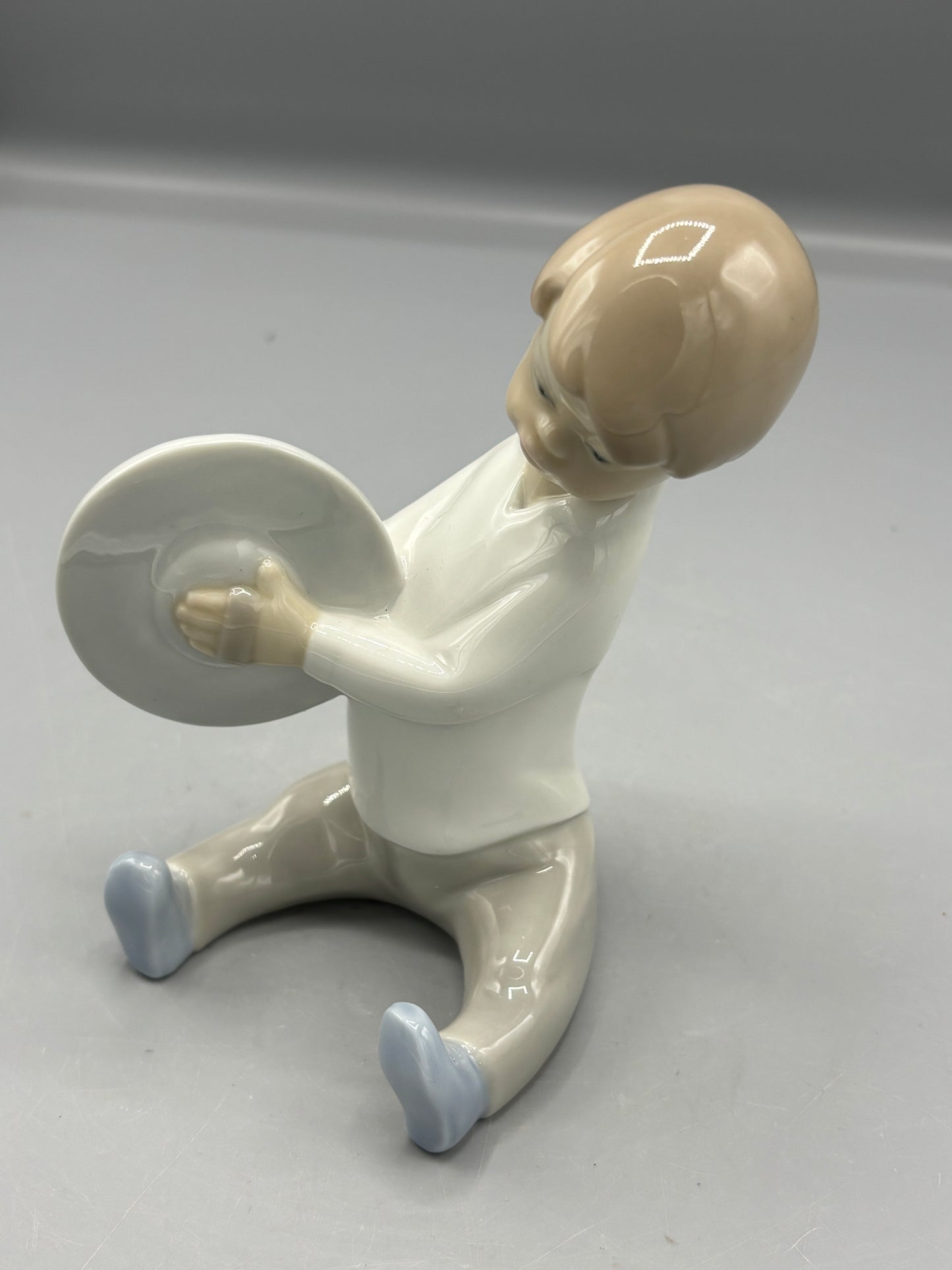 Lladro Boy playing Cymbals