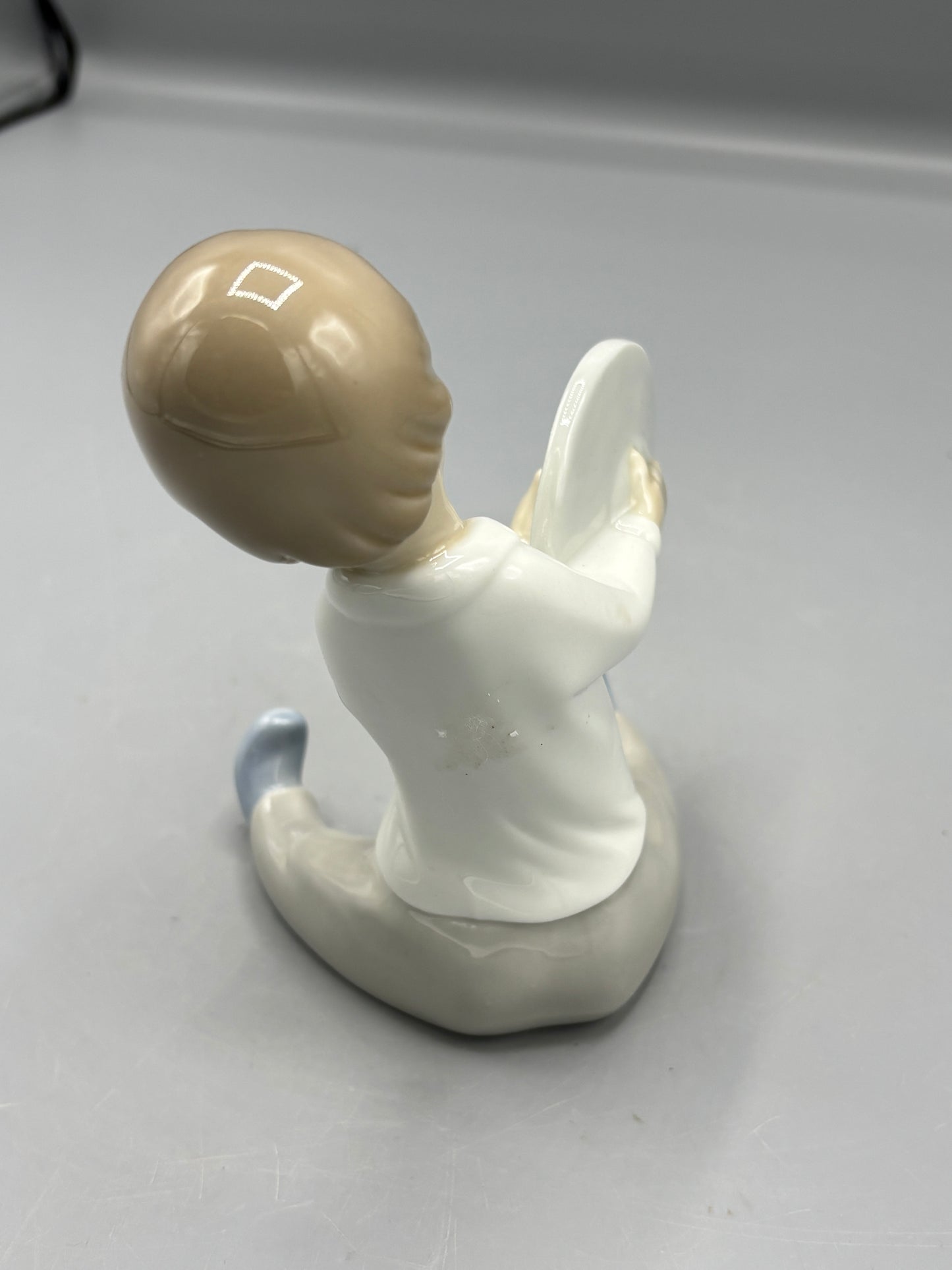 Lladro Boy playing Cymbals