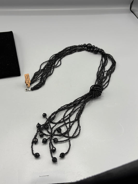 6 strand black bead Lariat