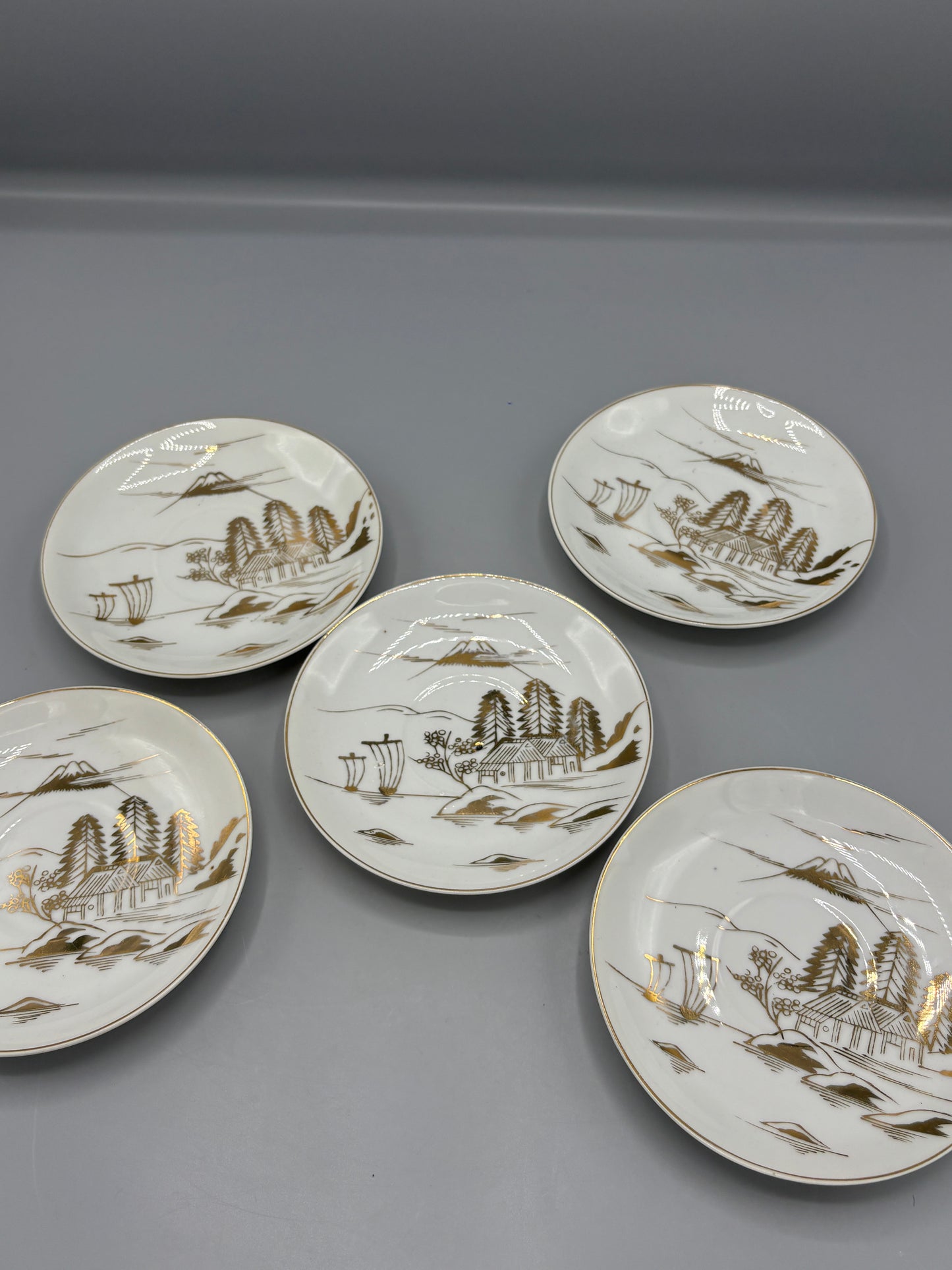 Japanese porcelain saucers with gold design