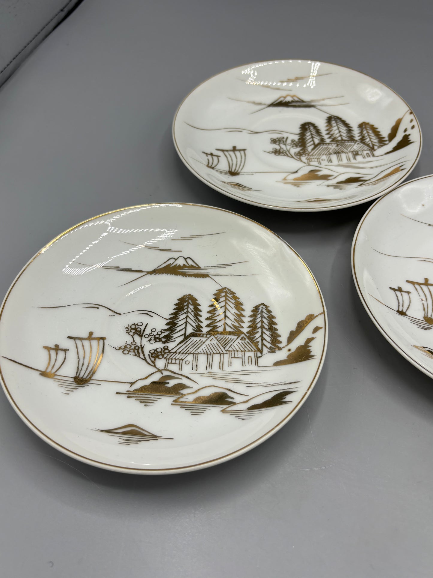 Japanese porcelain saucers with gold design