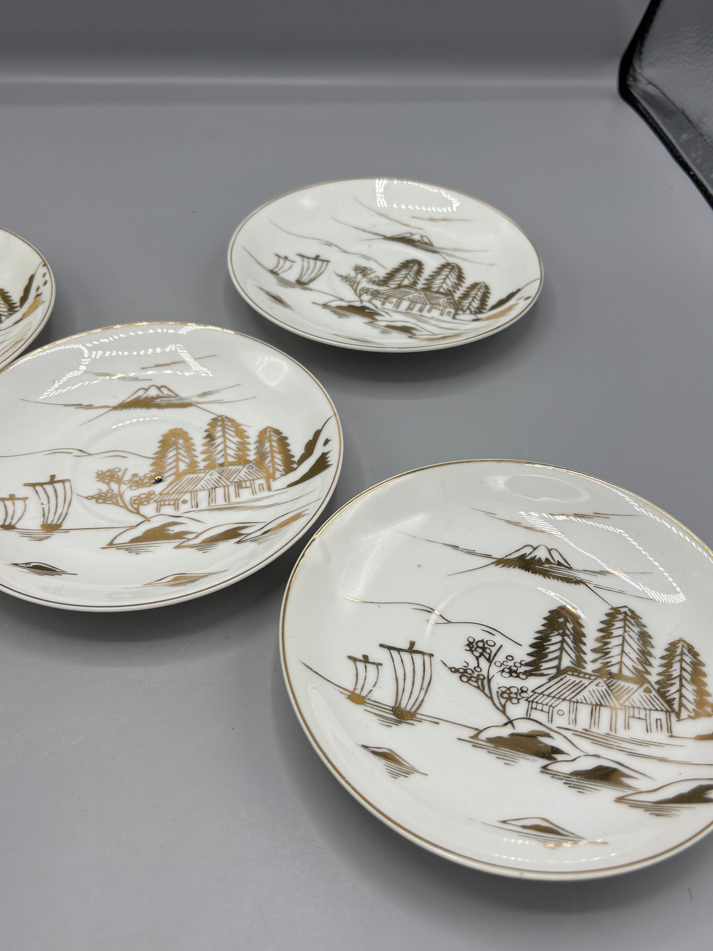 Japanese porcelain saucers with gold design