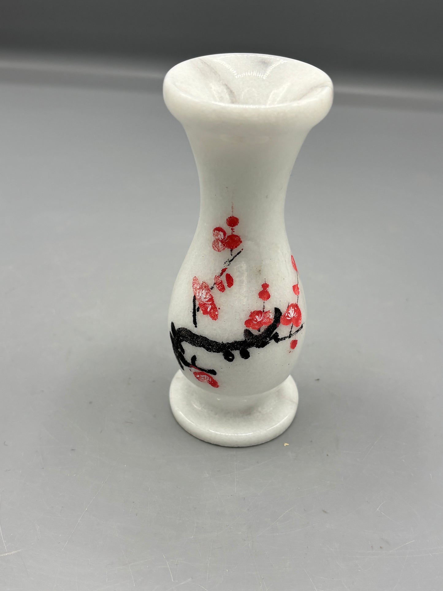 White marble vase with Cherry Blossom branch