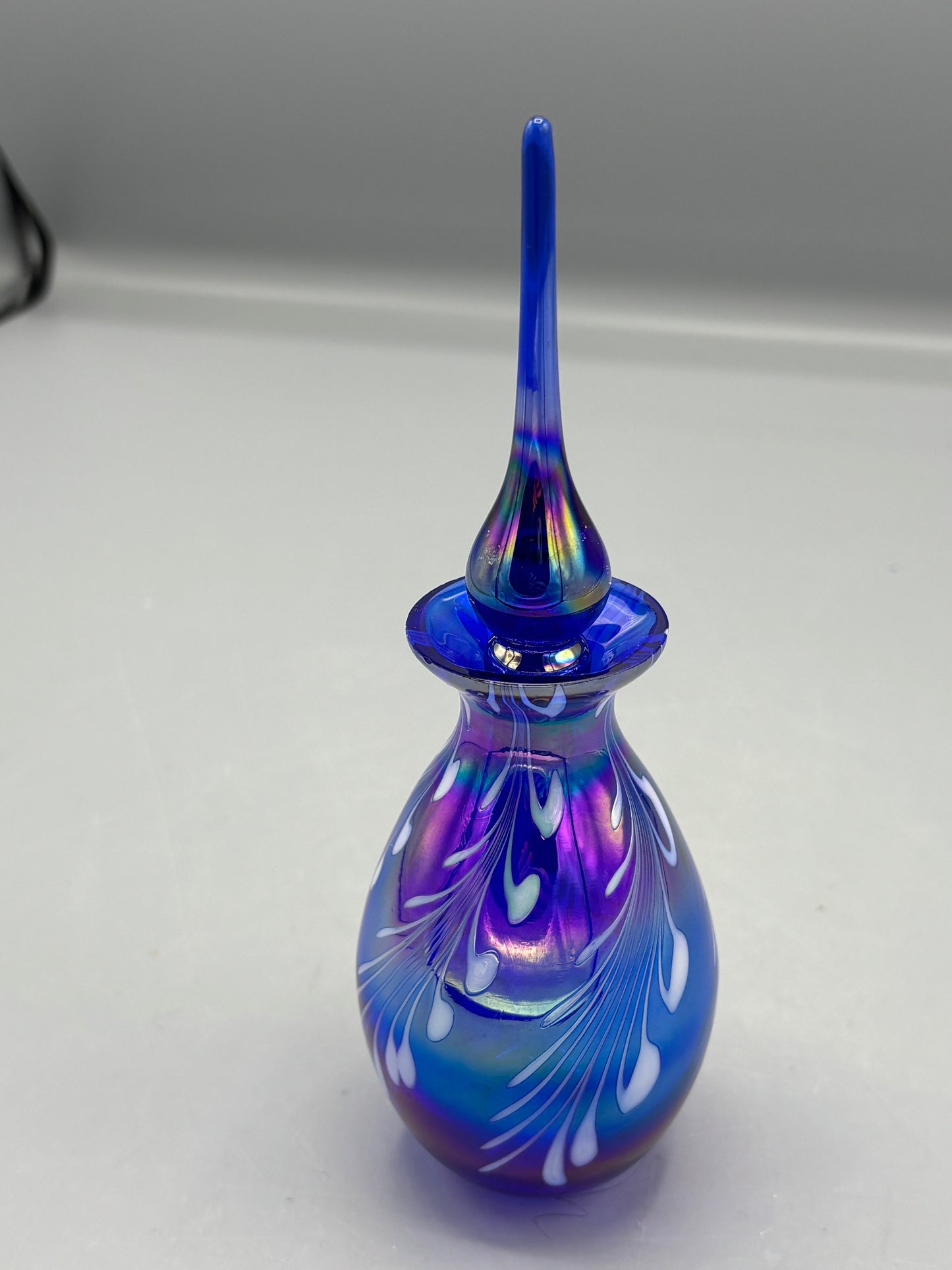 Cobalt blue iridescent bottle