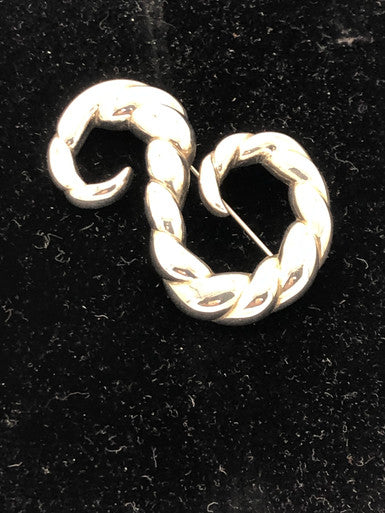 Silver tone swirl brooch