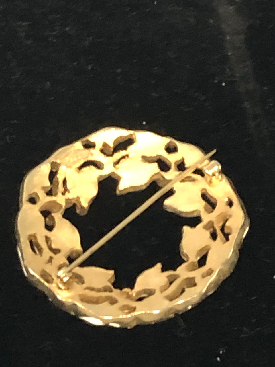 Gold tone white ivy circle brooch