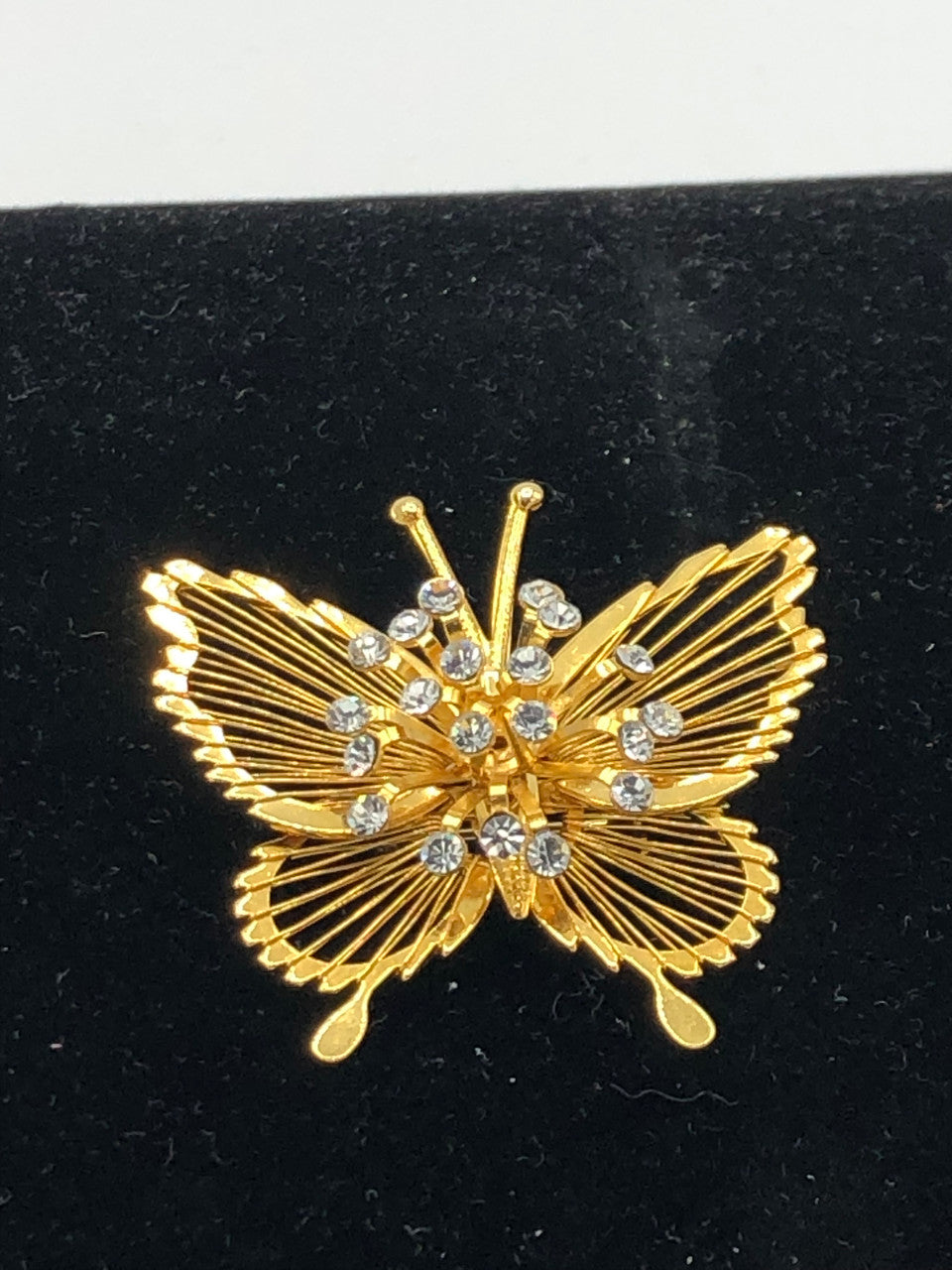 Gold tone jeweled butterfly brooch