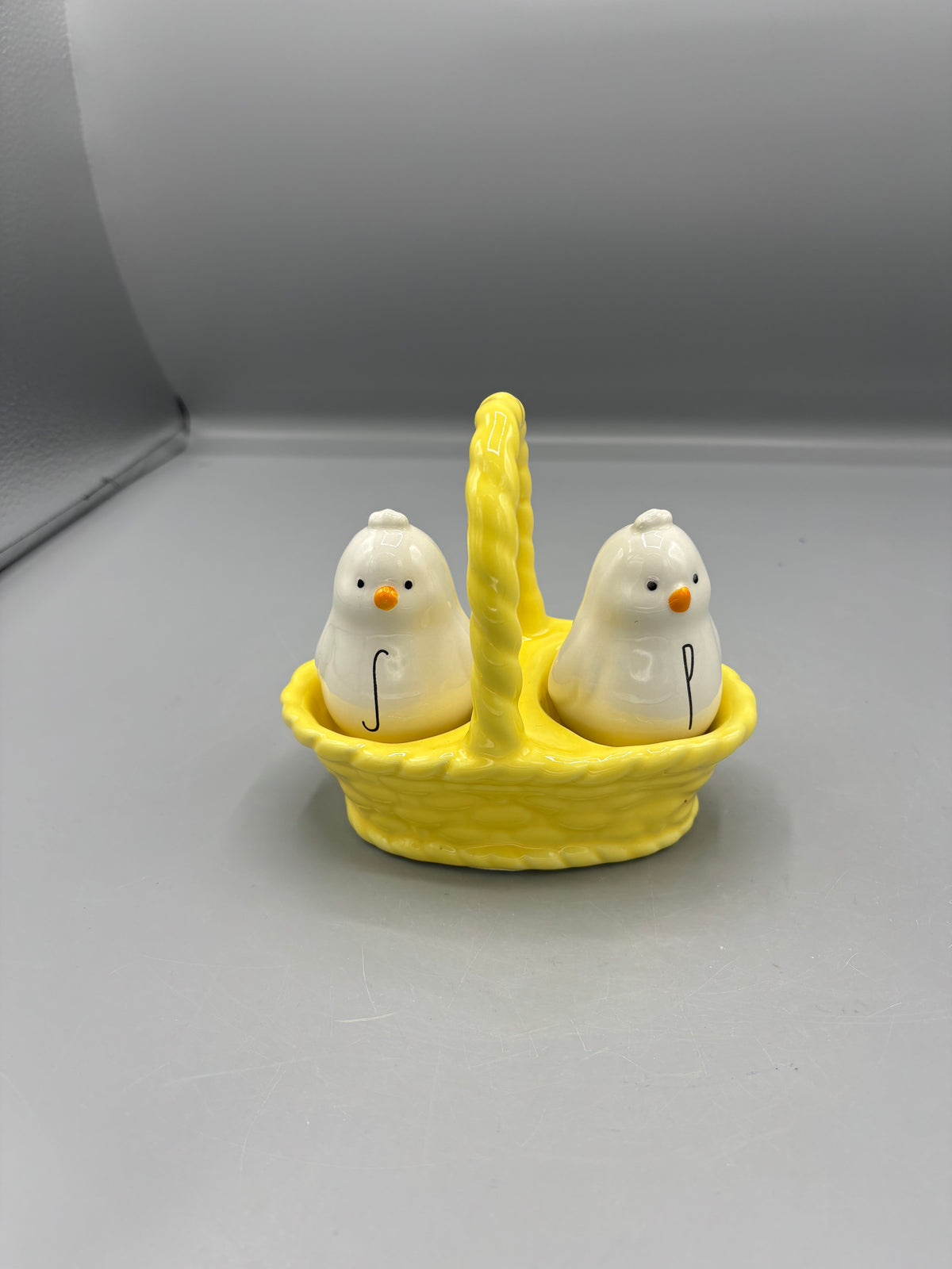 Rae Dunn ceramic chick S & P in basket