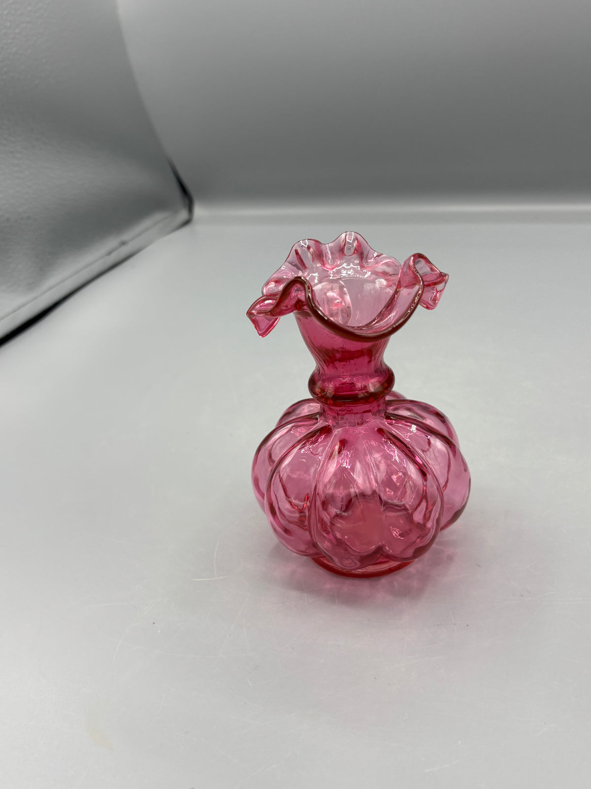Vintage Fenton cranberry pitcher with clear handle