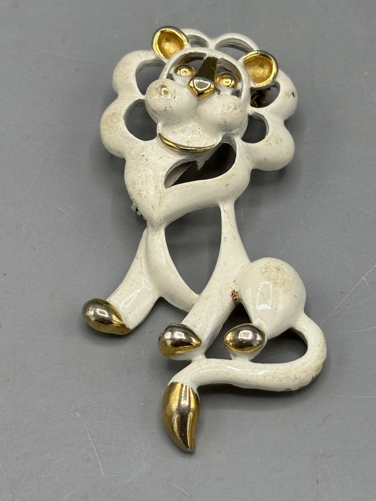 Gold tone Cream enamel Lion brooch