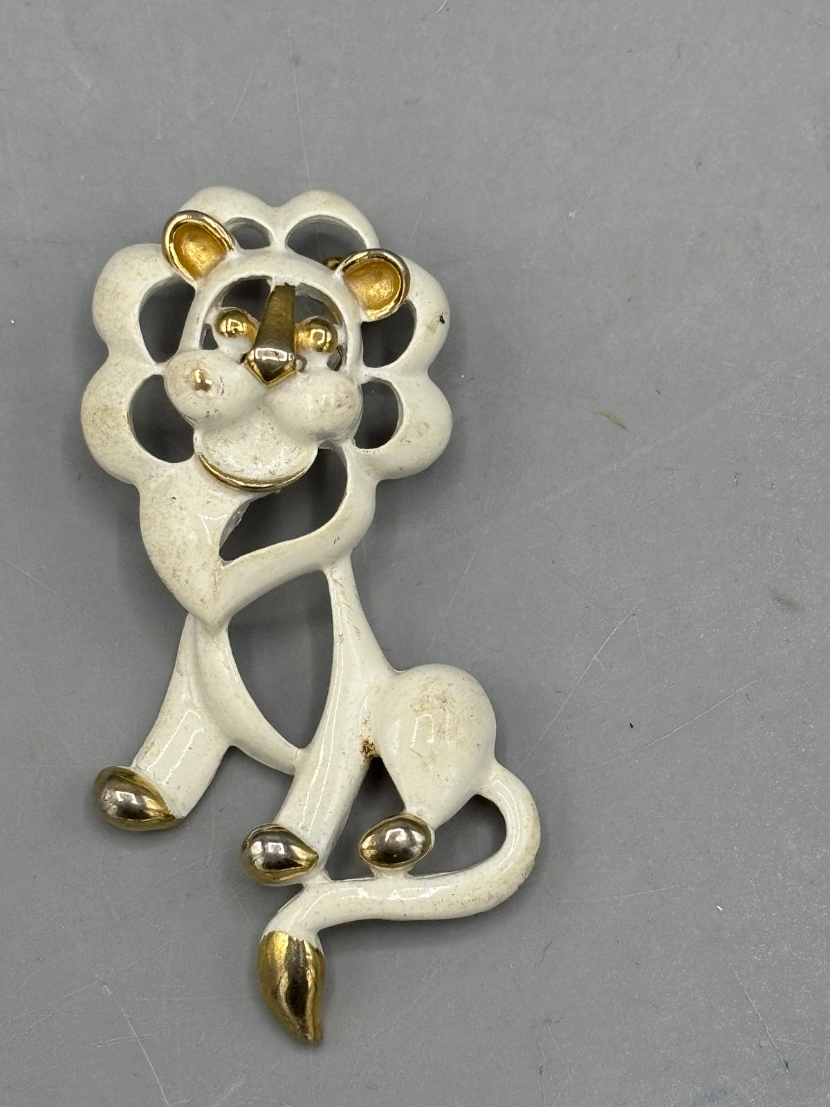 Gold tone Cream enamel Lion brooch