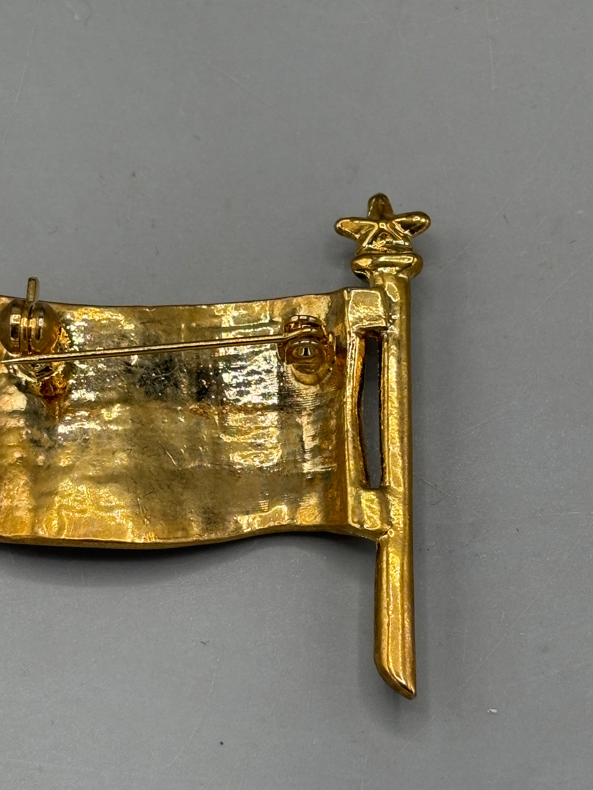 Gold tone American flag brooch