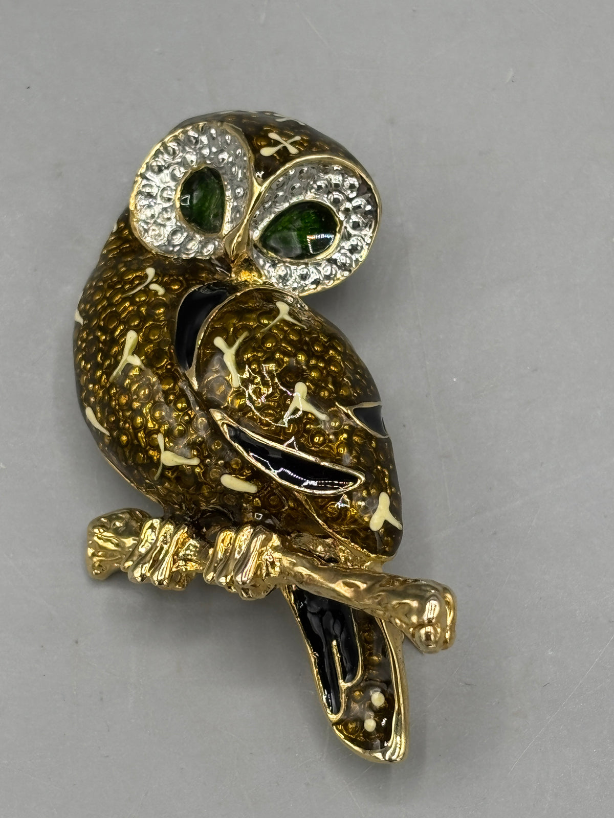Gold tone Owl brooch with green crystal eyes