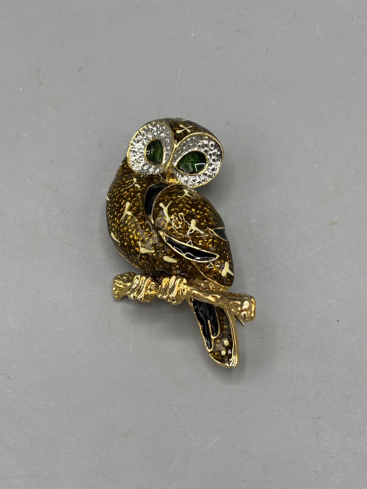 Gold tone Owl brooch with green crystal eyes