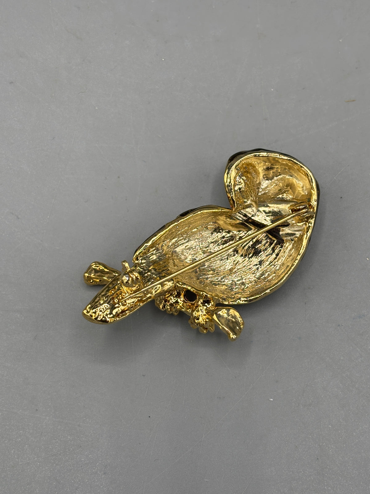 Gold tone Owl brooch with green crystal eyes