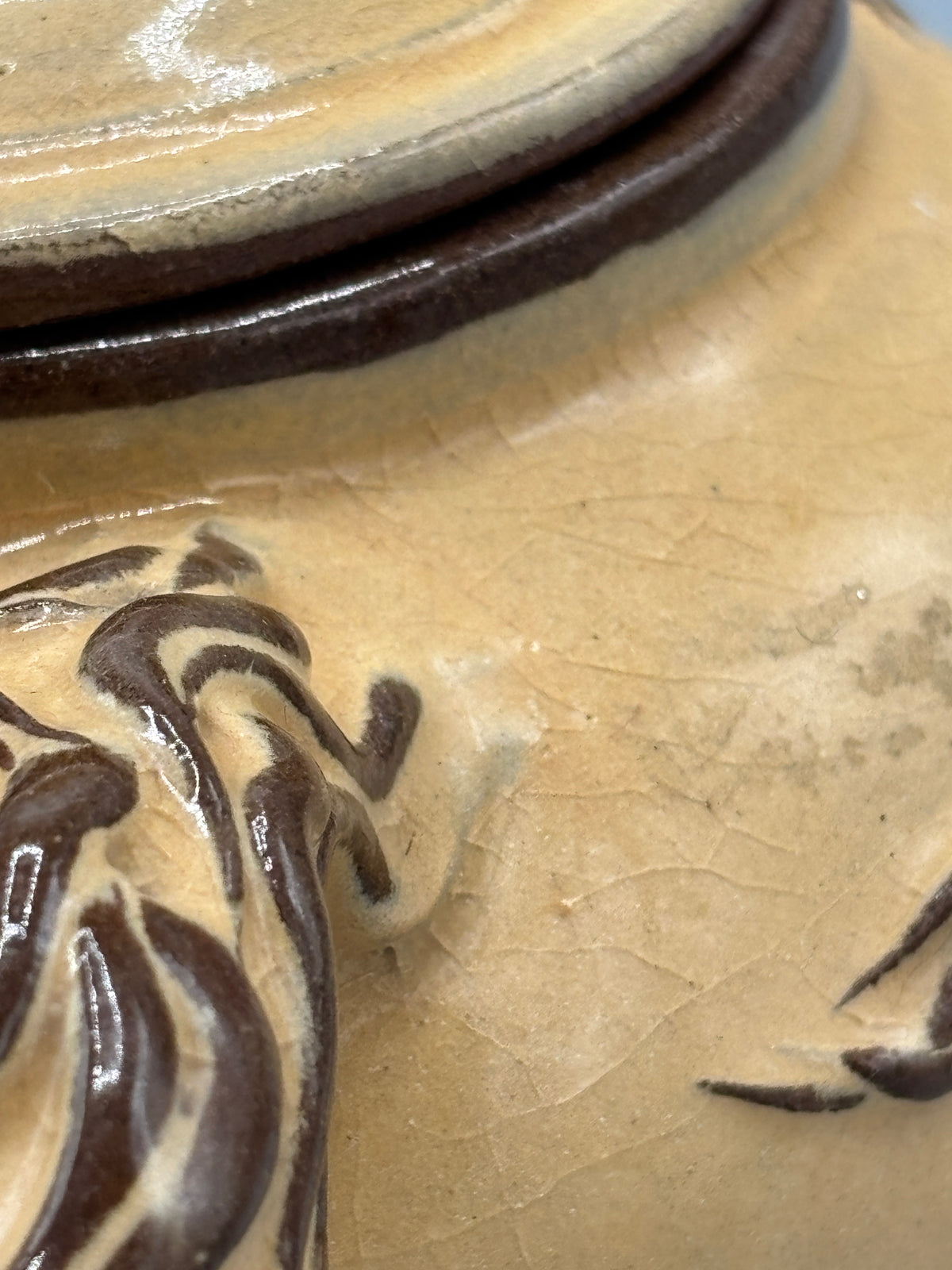 Light Tan ceramic teapot with animal design
