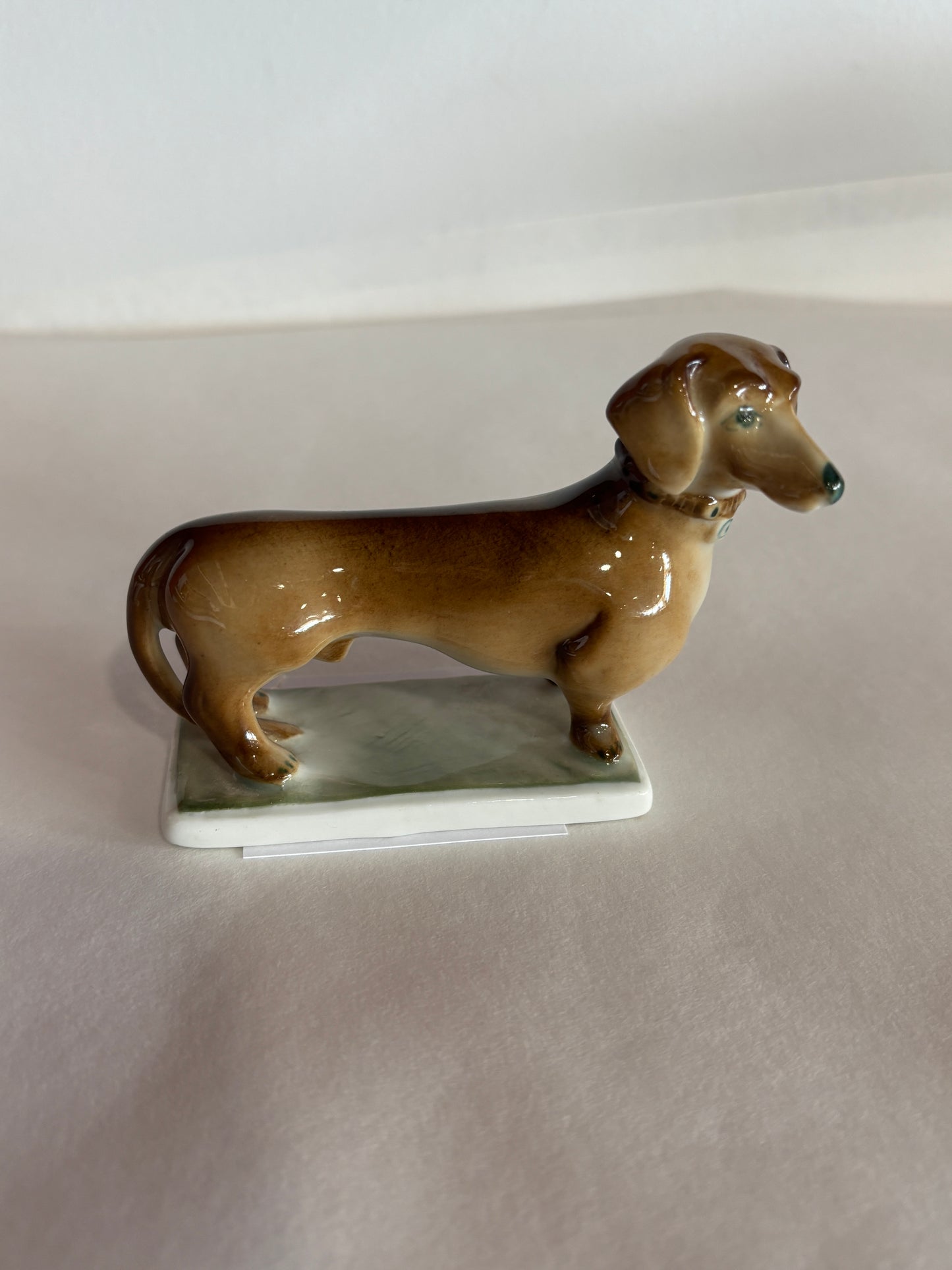 Vintage Zsolnag Hungary Dachsund Dog on Green Stand w/ Green Stamp