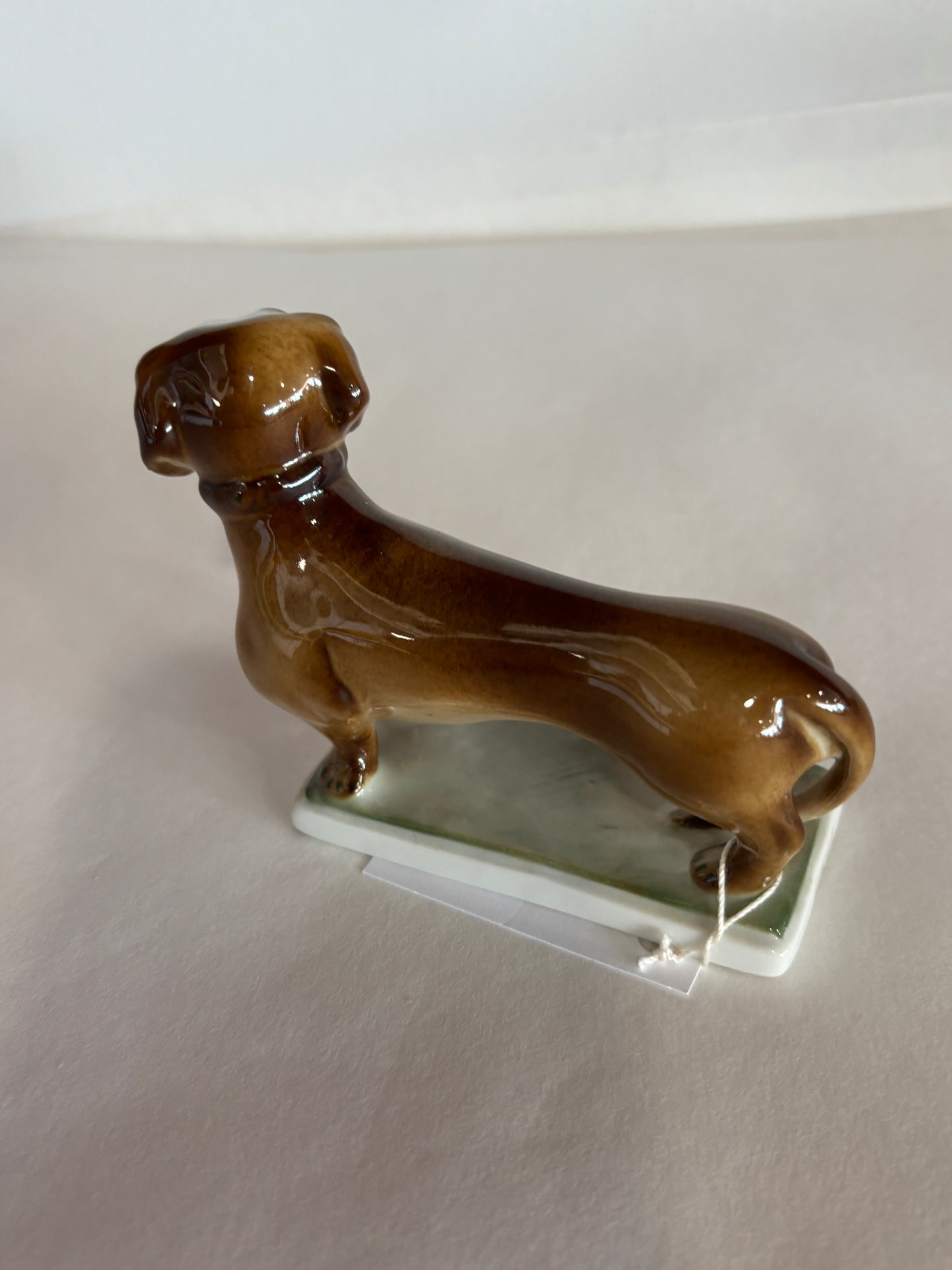 Vintage Zsolnag Hungary Dachsund Dog on Green Stand w/ Green Stamp