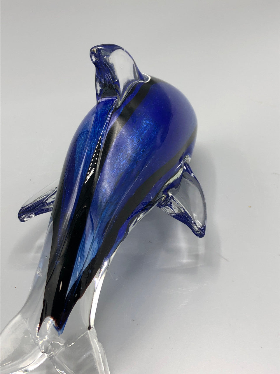 Blue glass dolphine figure